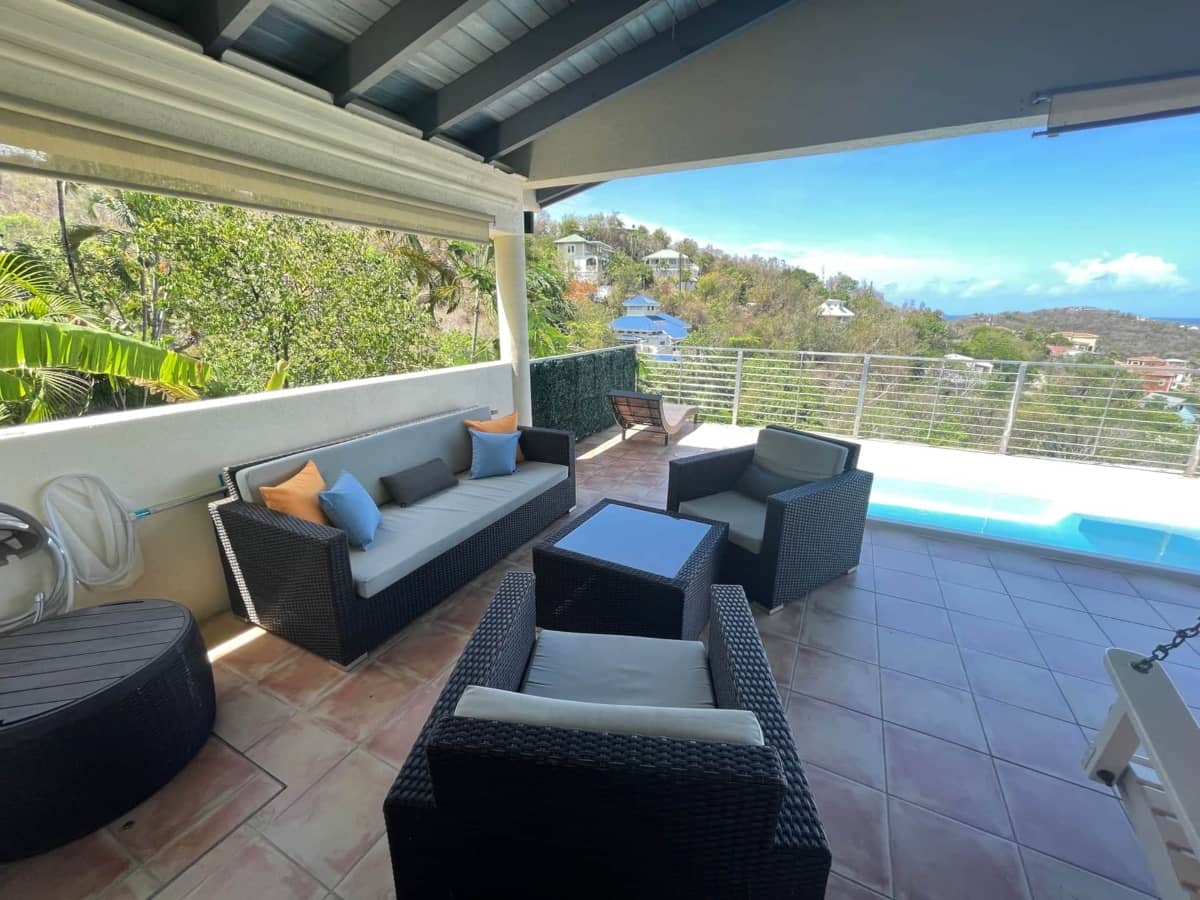 Patio where guests can hangout with pool nearby